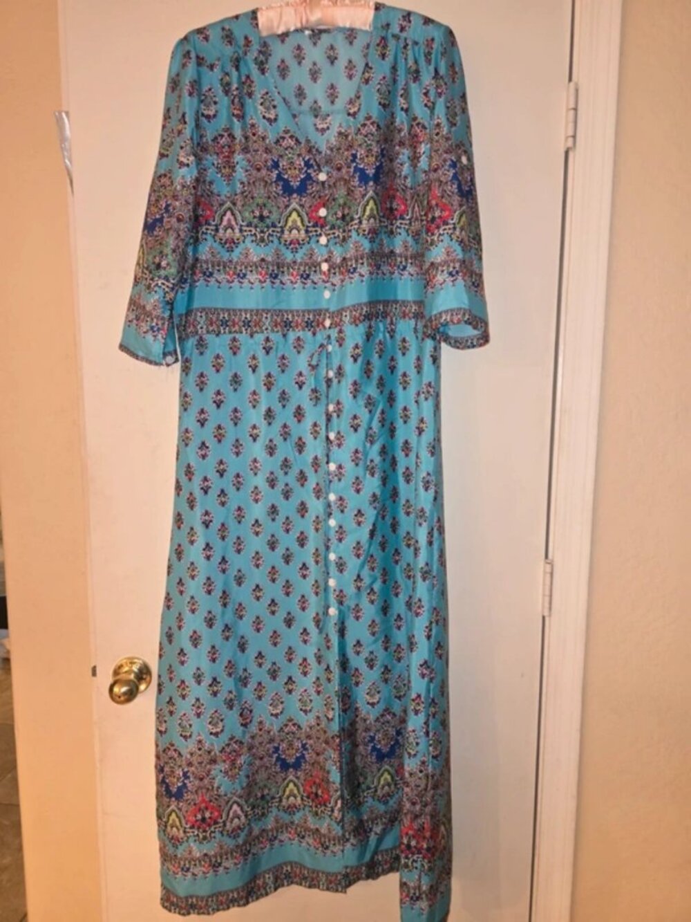Ladies long turquoise dress.